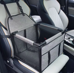 Light gray FurFree pet car seat and travel bed installed in a vehicle