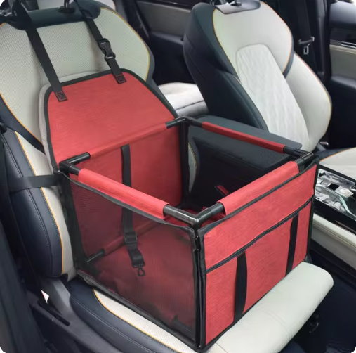 Bright red FurFree pet car seat and travel bed installed in a vehicle