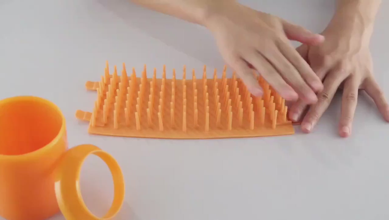 FurFree 360 degree paw cleaner removing mud from a dog's paw